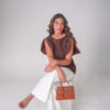 BLUSA CON CORTE ASIMETRICO